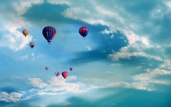 Colorful Hot Air Balloons Flying Up Above The Blue Sky