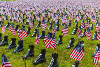 Wallpaper Id A Memorial Display Of Rows Boots With