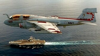 A6 Intruder Over Aircraft Carrier Wallpaper