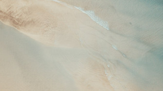 Vertical Of Sand And Beach With Transparent Clean Sea Water