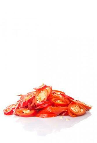 Chopped Red Chilli Over White Background Royalty Stock Image