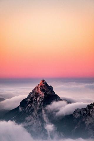 Photo Aerial Of A Mountain Covered In Fog Under The
