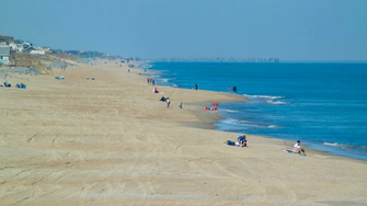 Outer Banks Visitors On Nags Head Beach In North Carolina Enjoying