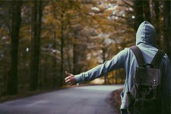 Men S Blue Hoodie Jacket And Brown Backpack Image