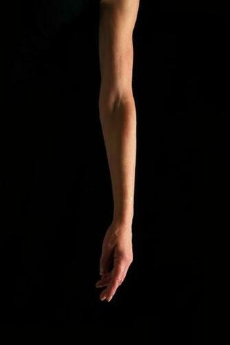 Arm Against A Black Background Photograph By Victor De