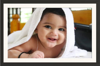 Frame Of Cute Baby Boy Smiling Wearing Towel Wall Hanging Framed