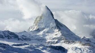 Snow Covered Peak In The Clouds Wallpaper And Image