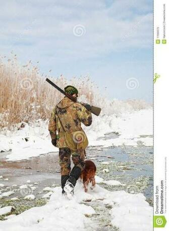 Stock Photo Hunter With His Hunting Dog During A Winter Hunt