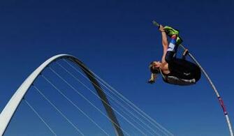 In The Womens Pole Vault With Millennium Bridge Background