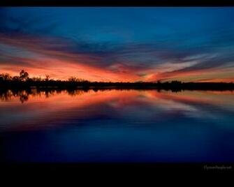 Evening Calm Sunset At Herington Lake