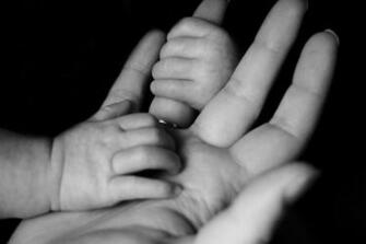 Family Mother Small Holding On Public