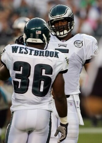Donovan Mcnabb Of The Philadelphia Eagles Talks With Teammate Brian