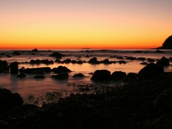 Sunset Ocean Dark Rocks Wallpaper Stock