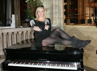 Amanda Holden Sits On Piano In Black Opaque Pantyhose