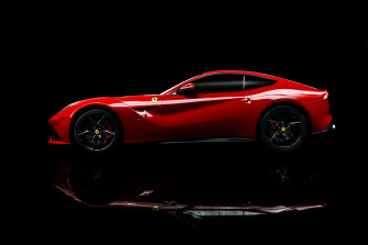 Red Sports Car Ferrari F12 Berlinetta On A Black Wallpaper