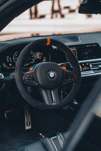The Interior Of A Car With Steering Wheel And Dashboard Photo