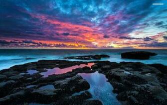 Ocean Black Rocks Pink Sky Wallpaper