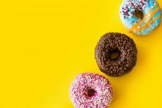Yummy Donuts On Yellow Background Stock Photo Picjumbo