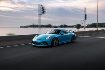 A Blue Sports Car On Road Photo Chicago Image