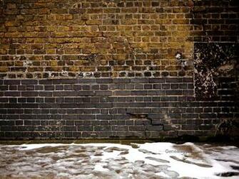 Image Snow In Front Of Old Brick Wall