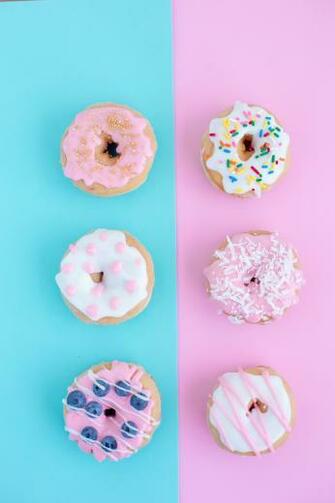 Doughnuts On Turquoise And Pink Background Pixeor Stock