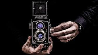 Person With Twin Lens Reflex Camera Wallpaper Stream