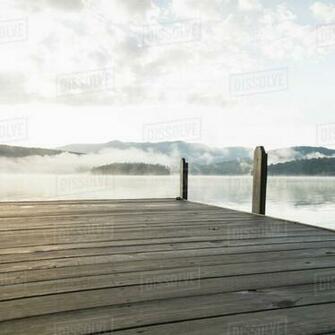 Usa New York Lake Placid Pier With Foggy In Background