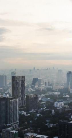City With Buildings And Cloudy Sky Wallpaper
