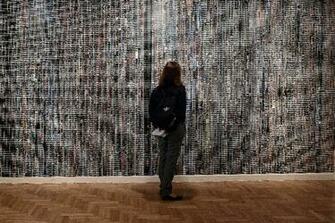 Visitor Looks At iPhone Wallpaper Consisting Of A Series