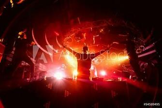 Fotografie Obraz Dj Hands Up In Night Club Party Background