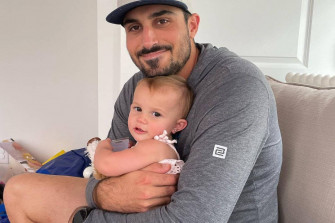 Zach Eflin Hugging His Daughter Wallpaper