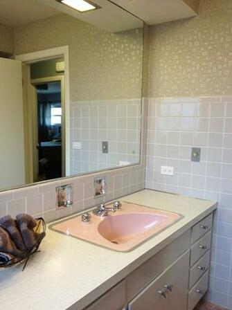 Bradbury Atomic Age Wallpaper Makes These Two 1950s Pink Bathrooms