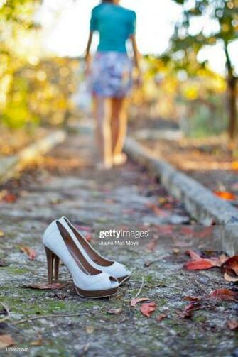Outdoor Heeled Shoes In Autumn And Barefoot Girl The Background
