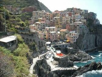 Above A Quaint Little Village Built Into The Rocky Coastline