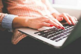Person With Red Manicure Typing On Laptop HD Wallpaper