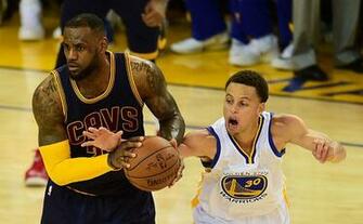 Stephen Curry Right Of The Golden State Warriors Attempts To Steal