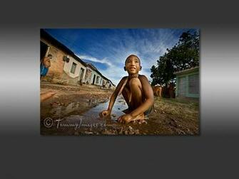 Computer Desktop Wallpaper A Cuban Boy Playing In Puddle