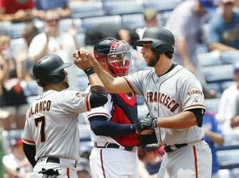 Atlanta Braves Catcher Tyler Flowers Looks On In The Background