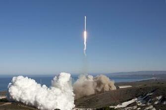 An Upgraded Spacex Falcon Rocket Roars To Life In This Split Screen
