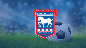 Ipswich Town Football Club Celebrating Victory On The Pitch Wallpaper