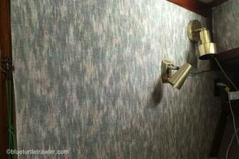Two Old Lighting Fixtures Were On Each Side Of The V Berth