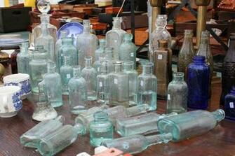 Petite Vintage Bottle Floral Arrangements The Home And Garden