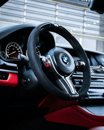 The Interior Of A Car With Steering Wheel And Dashboard Photo