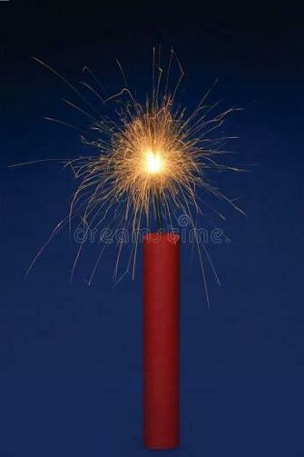 Dynamite Stick Of With A Lit Fuse On Blue Background