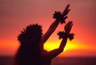 Hula Dancer During Sunset At A Maui Resort