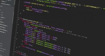 Web Developer Coding On Screen
