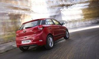 Hyundai I20 Red Color Rear Side Bulr City Background HD