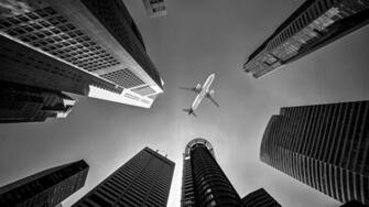 Buildings And Airplane Wallpaper Stream