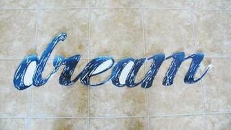 The Word Dreams In Cursive Wallpaper