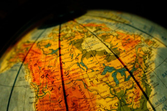 Close Up Of Glowing Globe Map 7ozyy0q9ktdgn8p3 Wallpaper